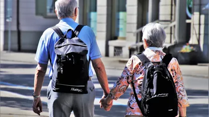 A retired couple walking